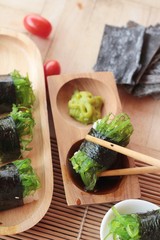 Sushi roll and seaweed salad is delicious.