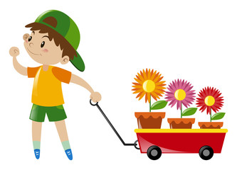 Boy pulling red wagon loaded with flowers