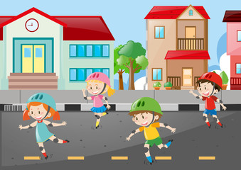 Obraz na płótnie Canvas Scene with four kids skating on the road