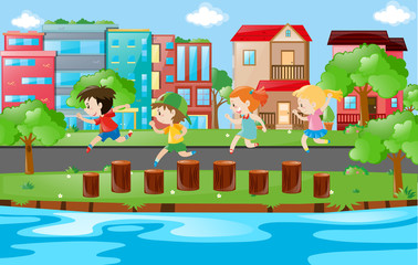 Children running on logs in park