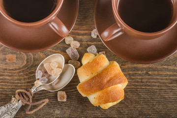 a croissant and a cup on the table
