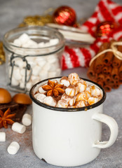 Hot chocolate with marshmallows, cinnamon and caramel sauce 