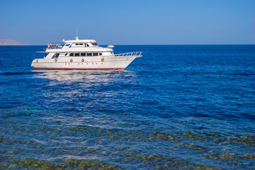 Fototapeta na wymiar Beautiful white yacht in Red sea, Sharm el Sheikh, Egypt