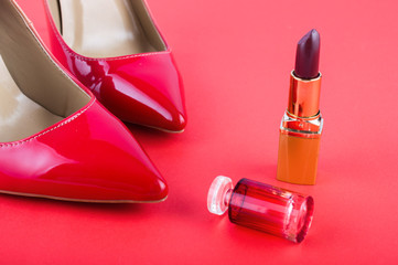 gradient classical shoes and pomade on a red background