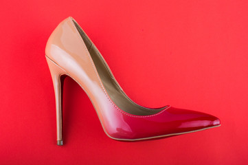 gradient classical shoes on a red background