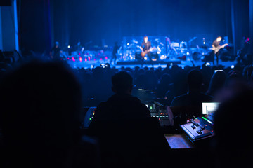 Soundman working on the mixing console.