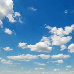 light cumulus clouds in the blue sky