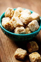 Brown sugar pieces in a bowl