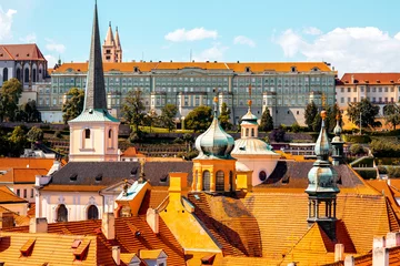 Foto op Canvas Cityscape view on the roofs and spires in lesser town in Prague © rh2010