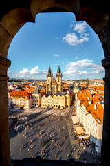Top cityscape view on the old town square with Tyn cathedral during the sunny day in Prague