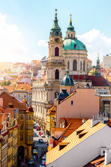 Cityscape view on the lesser town with saint Nicholas church in Prague city - obrazy, fototapety, plakaty