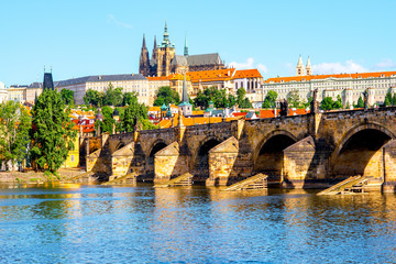 Obraz premium View on the Lesser town with Charles bridge and Vitus church in Prague city