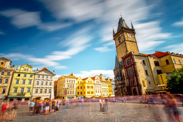 View on the old town square with the famous clock tower in Prague city. Long exposure image technic...