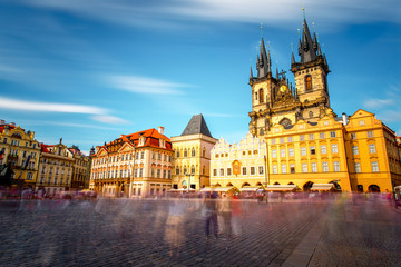 Fototapeta na wymiar View on the famous cathedral on the old town square in Prague city. Long exposure image technic with blurred people and clouds