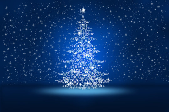 Christmas tree from snowflakes on an abstract blue background