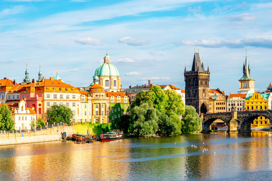 Citycsape view on the riverside with the bridge and old town in Prague