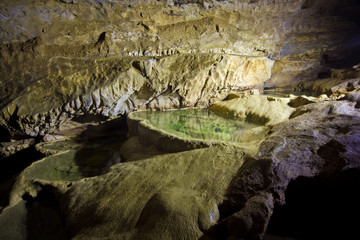 Natural speleothem, cascades of lakes and waterfalls in Nizhneshakuranskaya cave, Abkhazia, Georgia