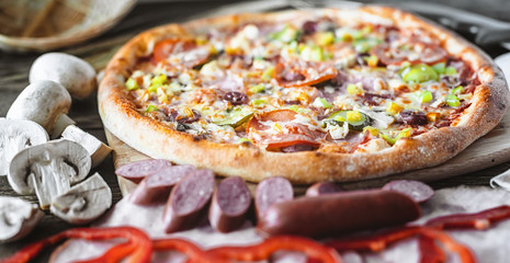 Pizza and ingredients with low depth of field