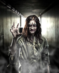 Horror zombie in a dark corridor.