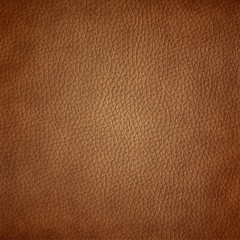 Brown leather texture closeup background.