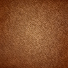 Brown leather texture closeup background.