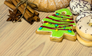 Christmas cookies elegantly decorated with cinnamon sticks and anise seeds