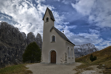 Fototapeta na wymiar Church on a hill in the Dolomites