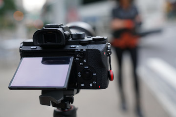closeup of photo camera set on tripod