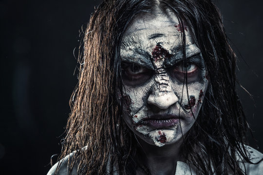 Zombie woman with bloody face