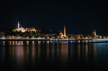 Fototapeta na wymiar View of Fishermen Bastion and St. Matthias church nicely illuminated at night, Budapest, Hungary