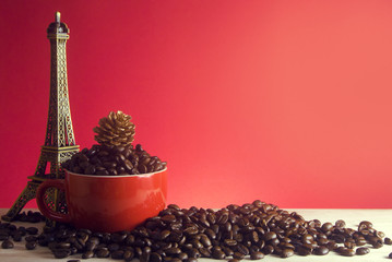 cup of coffee with pine cone and eiffel tower decor