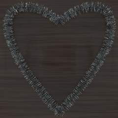 Silver tinsel heart on a wood background