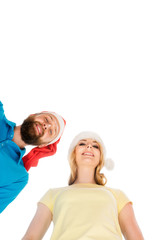 Couple of happy teenagers in Christmas hats