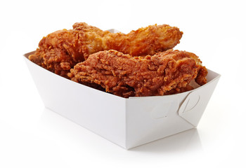 Fried breaded chicken in white cardboard box