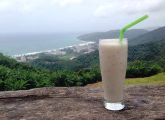 banana smoothies on Karin beach background, Thailand 