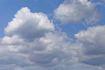Naklejka na ściany i meble Cloudy blue skies background