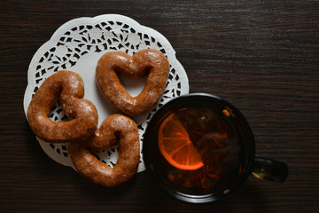 tea and sweets on the black wooden table