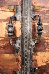 wrought iron door handle on copper background