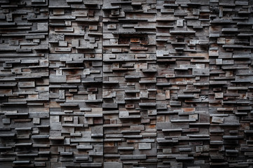 exposed wooden wall exterior, patchwork of raw wood forming a beautiful parquet wood pattern,Wood wall pattern,for background