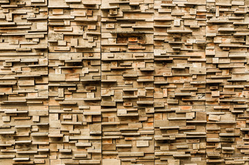 exposed wooden wall exterior, patchwork of raw wood forming a beautiful parquet wood pattern,Wood wall pattern,for background