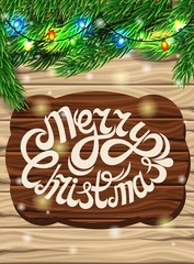 Christmas decoration on the background of the wooden planks. Christmas tree branch, bright multi-colored lights on a bright wooden. Poster for the New Year and Christmas.