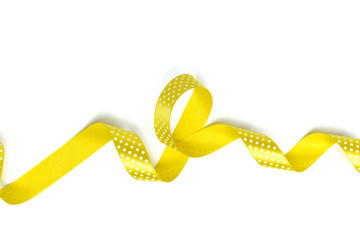 Yellow ribbons isolated on white