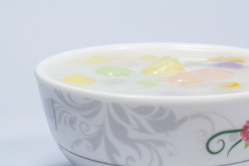 Three color rice dumpling in coconut milk 
Three color rice dumpling in coconut milk on white background