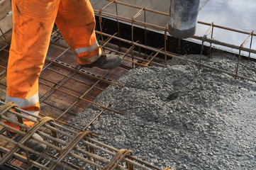 Concreting of slab pouring concrete engineering construction with rebar and formwork