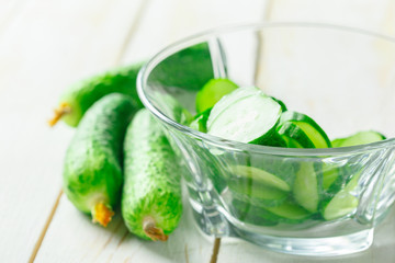  cucumbers on wooden background