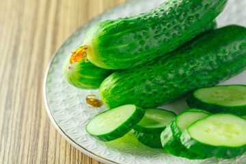  cucumbers on wooden background