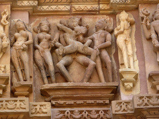 Sculptures of loving couples, illustrating the Kama Sutra