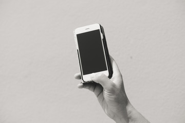 Closeup woman hand using smart phone, top view mock up background