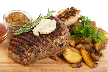 meat steak and Grilled vegetables on cutting board on white back