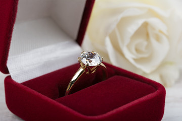 Diamond wedding ring in a red gift box